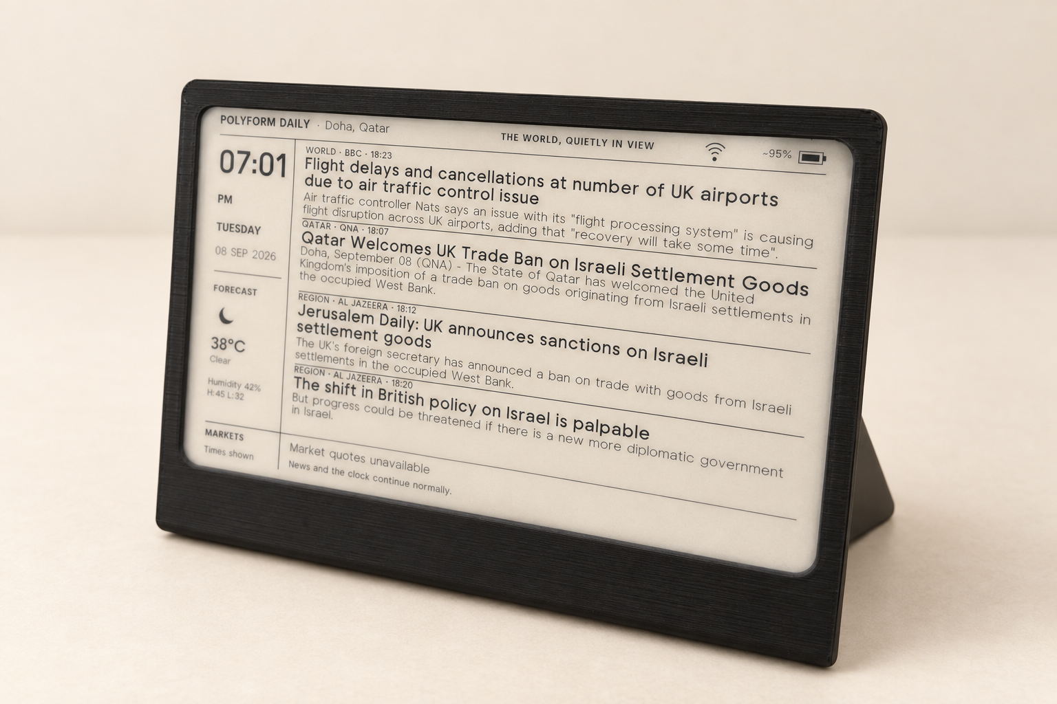 Cleaned-up product image of the black POLYFORM Daily prototype showing its e-ink dashboard